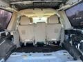 Interior view of a 2013 Ford Expedition showing the empty rear passenger seating area with light-colored upholstery and no seats installed