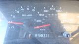 Dashboard of a 2006 Ford Econoline displaying speedometer and RPM gauges with indicators for fuel and transmission selection