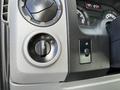 Close-up of the control panel in a 2019 Ford Econoline displaying the headlight and fog light switches alongside a multifunction knob for vehicle settings