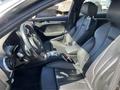 Interior of a 2016 Audi A3 featuring black leather seats and a modern dashboard with steering wheel and controls