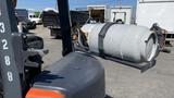 A 2018 Toyota 8FGCU25 forklift with a large gray propane tank securely attached to its forks