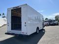 A white 2007 Ford Econoline cargo van with an open rear and no visible windows on the sides