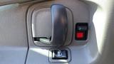 Interior door handle and control buttons of a 2015 GMC Savana