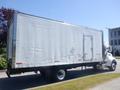 A 2008 Peterbilt 335 truck with a large white box trailer featuring a side door and visible paneling marks