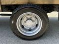 Close-up of a silver rim and black tire mounted on a 2020 Hino 195 vehicle