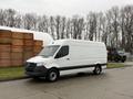 A white 2019 Mercedes-Benz Sprinter van with a high roof and a black stripe along the bottom