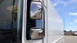 A white 2011 Ford Econoline with large side mirrors showing a reflection of the surrounding area