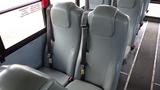 Interior seats of a 2015 International PC105 school bus featuring gray upholstery and seat belts