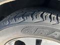 Close-up of a tire on a 2012 Kia Sportage showcasing the tread pattern and brand name clearly visible on the sidewall