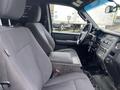 Interior view of a 2017 Ford Expedition showing two front seats and the dashboard with controls and steering wheel