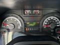 Dashboard of a 2019 Ford Econoline displaying gauges for fuel level and engine temperature along with an odometer reading of 64916.3 miles