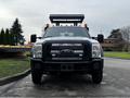 Front view of a 2015 Ford F-550 Super Duty truck with a black grille and light bar mounted on top