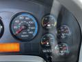 Dashboard of a 2011 International 7300 displaying speedometer fuel gauge voltmeter and air pressure gauges