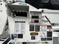 Control panel of a 2011 Western Star Trucks 4900 with various switches and warning labels