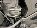 Close-up of the engine area of a 2013 BMW K1600GTL motorcycle featuring metallic components and rubber seals