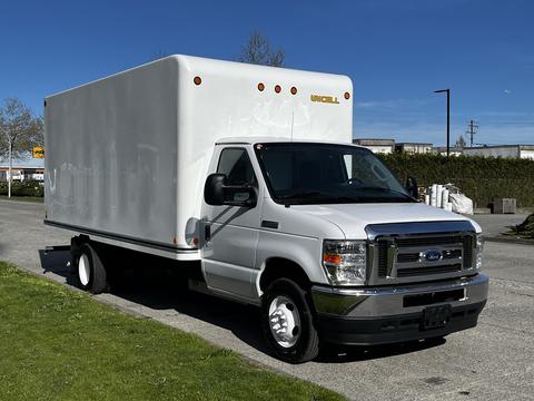 A 2019 Ford Econoline box truck in white with a large enclosed cargo area and a silver front grille