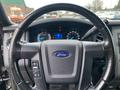 Interior view of a 2017 Ford Expedition steering wheel and dashboard displaying speedometer and various gauges