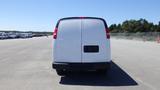 A white 2012 GMC Savana van viewed from the rear with a simple design and rectangular shape