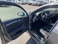 A 2016 Audi A3 with an open door showcasing the interior features including the dashboard steering wheel and front seats