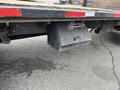 A steel storage box mounted under the bed of a 2007 International 4300 truck designed for tools or equipment storage