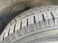 Close-up of a tire from a 2018 Chevrolet Express showing detailed tread patterns and a well-maintained surface