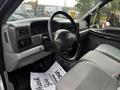 Interior of a 2008 Ford F-750 featuring a gray dashboard and seats with visible steering wheel and instrument panel