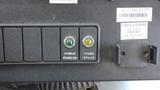 A control panel with labeled buttons for hybrid functionality including "HYBRID ENABLED" and "HYBRID SERVICE" indicators on a 2011 Ford Econoline