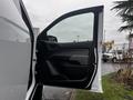 A 2019 Chevrolet Colorado with an open driver's side door showcasing the interior features and design