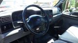 Interior view of a 2006 Ford F-650 showing the steering wheel dashboard and control panel