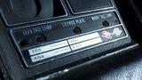 A black and silver dashboard panel labeled with specifications for a 1971 Chevrolet Corvette Stingray including horsepower and cubic inches