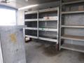 Interior shelves of a 2010 Forest River Enclosed trailer with metal framing and wooden surfaces