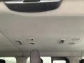 Interior view of a 2017 Ford Transit showing the overhead ceiling with light fixtures and ventilation vents