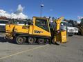 A yellow 2008 Camoplast SW 4S snow groomer with a snow plow attachment and tracks visible on the ground