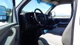 Interior view of a 2012 GMC Savana showing the steering wheel dashboard and driver's seat