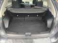 The interior trunk of a 2014 Subaru Impreza with a flat cargo area and no visible items or storage compartments