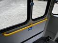 Interior view of a 2017 Chevrolet Express showing a yellow grab bar with a wheelchair symbol on the wall