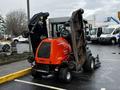 A 2020 Jacobsen HR800 turf maintenance vehicle with raised mowing decks showcasing its compact design and bright orange color