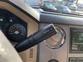 A close-up view of the tow haul control lever inside a 2013 Ford F-450 SD vehicle's interior