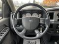 Interior view of a 2008 Dodge Ram 5500 featuring a steering wheel with controls and a dashboard displaying gauges and a radio system