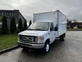 A white 2019 Ford Econoline box truck with a large cargo area and front grille showing the Ford emblem