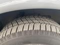 Close-up of a treaded tire from a 2017 Chevrolet Express showing detailed patterns and grooves on the rubber surface