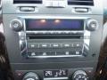 Dashboard of a 2008 Cadillac Limousine featuring a radio control panel with buttons for tuning and volume adjustment along with temperature display and climate controls