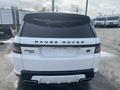 A white 2020 Land Rover Range Rover Sport viewed from the rear showcasing its sleek design and distinct branding