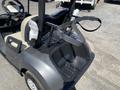 2019 Yamaha G29 E Electric G29 Golf Car with a black and grey body featuring a storage rack and beige seats