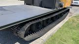 2015 PowerBully Tracked Flat Deck Equipment Carrier with wide tracks and a flat loading surface designed for transporting heavy equipment