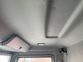 Interior view of a 2018 Hino 308 truck showing the overhead cabin area with a storage compartment light and smooth ceiling design