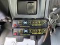 Two black control panels with yellow indicators and buttons labeled with symbols for a Star Warning Systems setup, mounted inside a vehicle's cabin