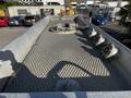 View from above of a 2013 Kenworth T370 truck bed featuring a textured surface and several fittings along the edges