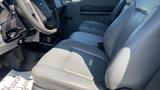 Interior view of a 2011 Ford F-450 SD featuring gray leather seats with manual adjustments and a steering wheel in front