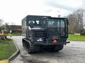 A 2023 Prinoth Panther T6 tracked utility vehicle with a black exterior featuring a cab and a low impact designation visible on the side